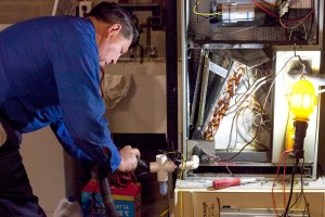 Nelson performing HVAC maintenance check